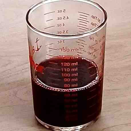 60 mL pomegranate juice in a measuring cup